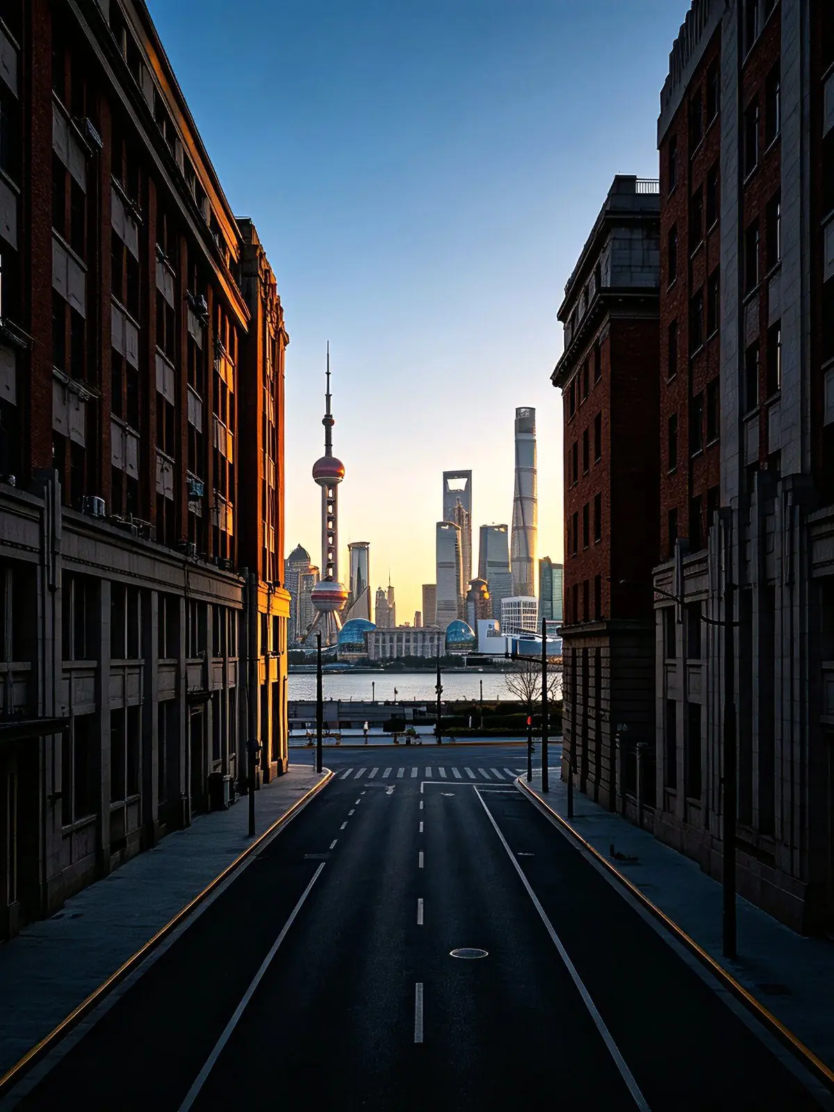 Shanghai's Lujiazui skyline seen from a quiet Bund side street at golden hour