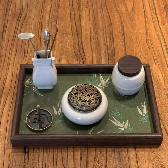 Tools and vessels arranged for a Chinese incense ritual